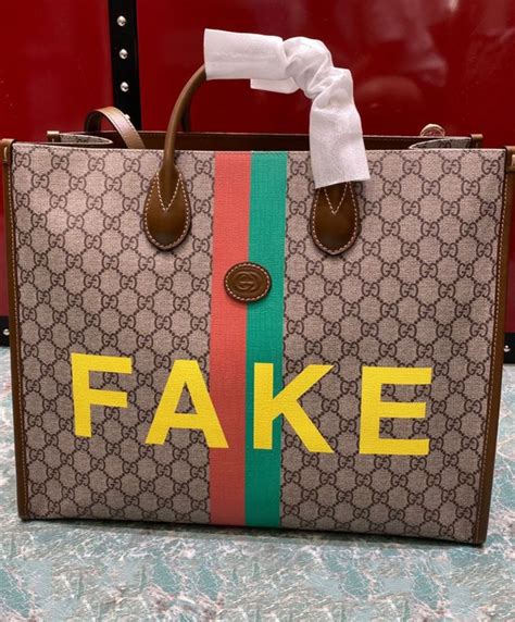 gucci bag with fake written on it